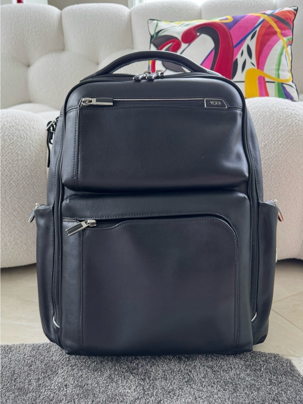 TUMI Arrivé Bradley Leather Backpack in black.